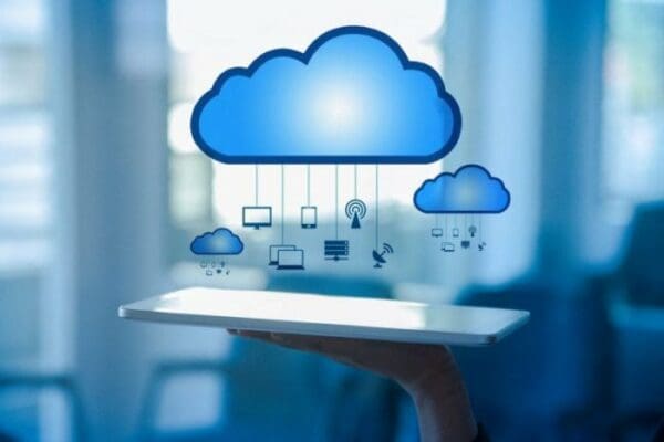 Graphic of a cloud connected to multiple devices including laptops, computers, iPads and iPhones