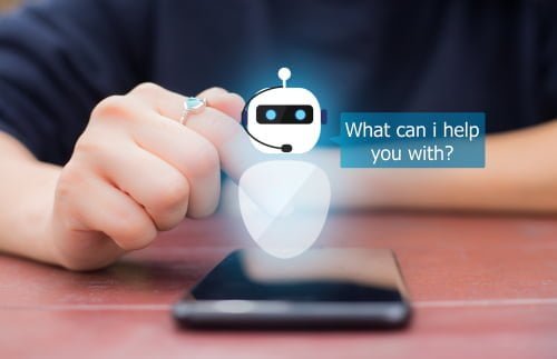 Cellphone on a table with a robot asking "what can I help you with?"