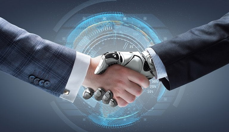 A closeup photo of a caucasian person's arm in a business suit shaking hands with a robot in a business suit