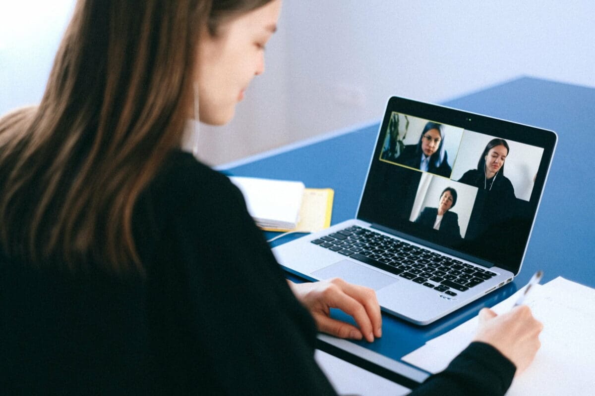 Three women using video call technology to work